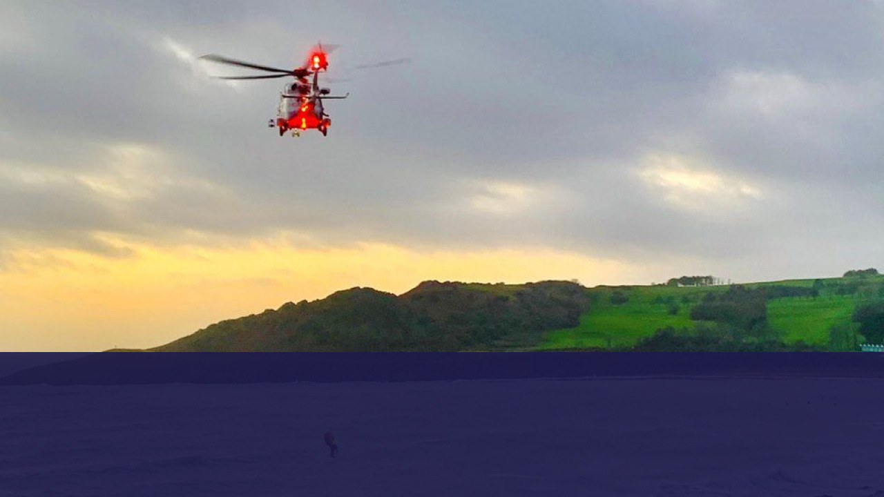 Two Pilots Eject Safely Before RAF Hawk T2 Crash on Anglesey 3 RAF Rescue Helicopter Flying Over Anglesey Coastline