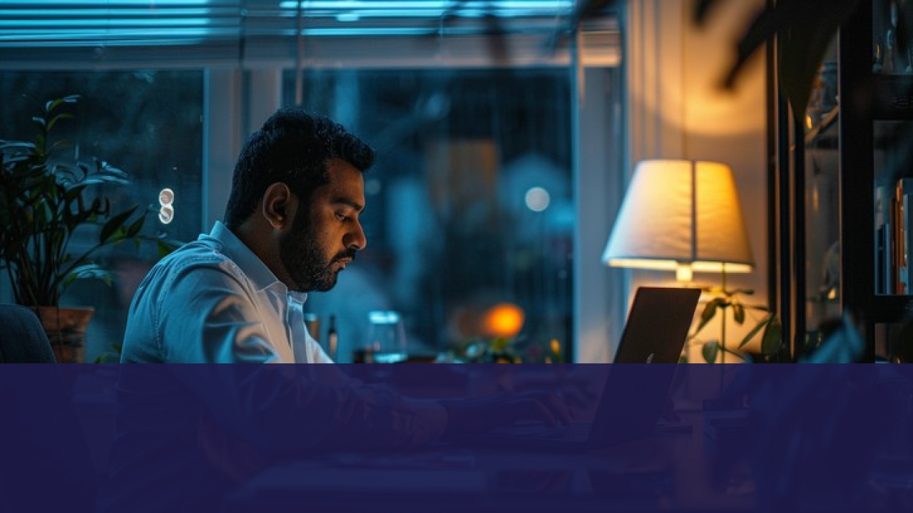 Professional working on laptop late at night